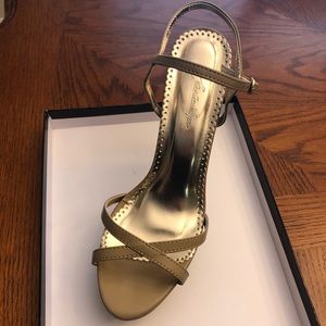 Shoes never worn outside. Worn 3-4 times in house.